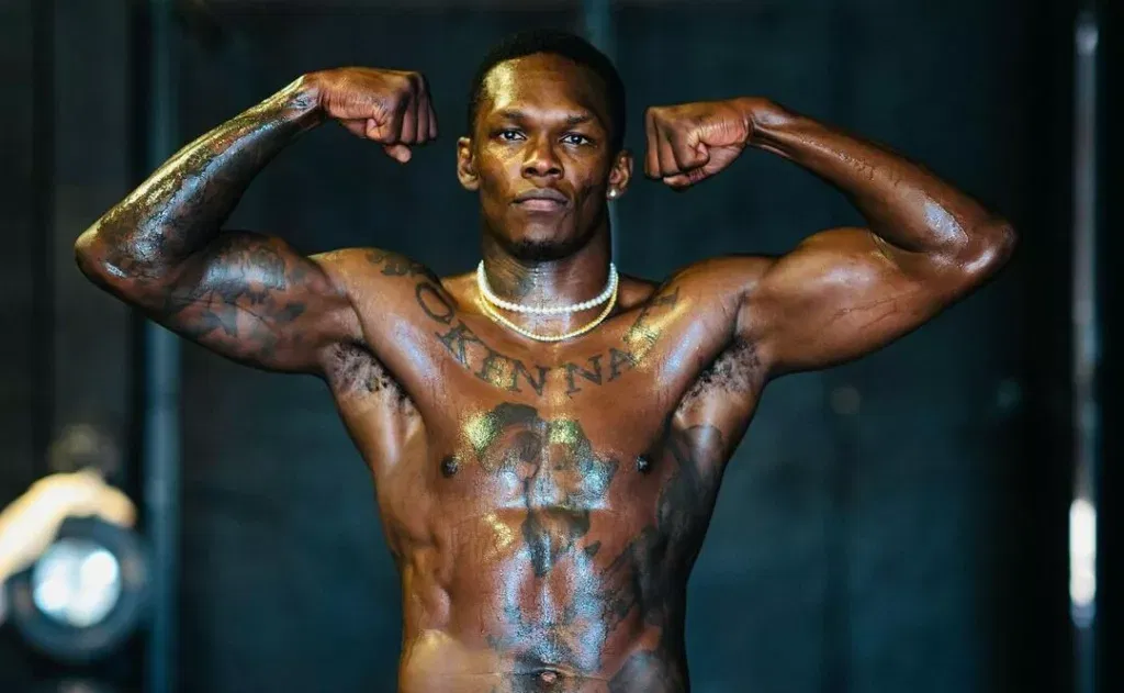 Israel Adesanya Image via Premium Times Nigeria The Revenue Gap: Tennis and UFC Fall Behind NBA and PL Stars