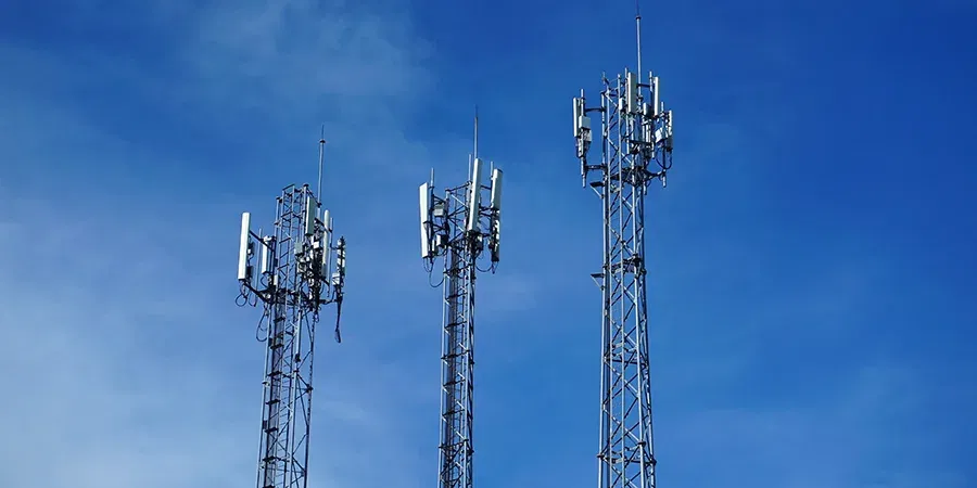 Mobile,phone,antenna,signal,tower,with,colorful,blue,sky,background