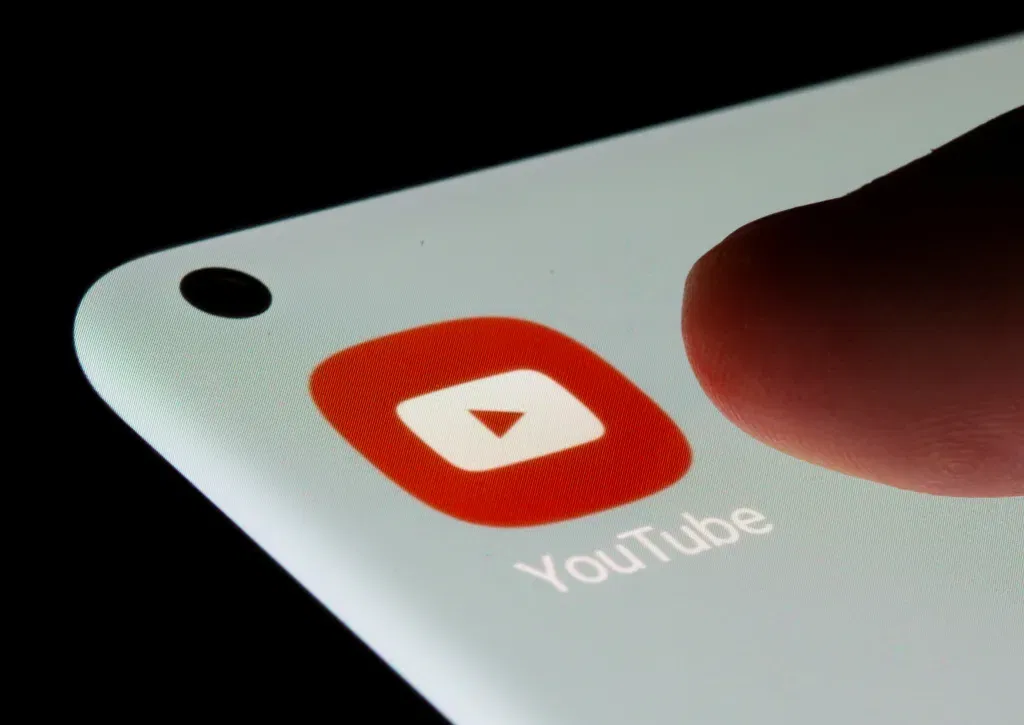 Youtube app is seen on a smartphone in this illustration